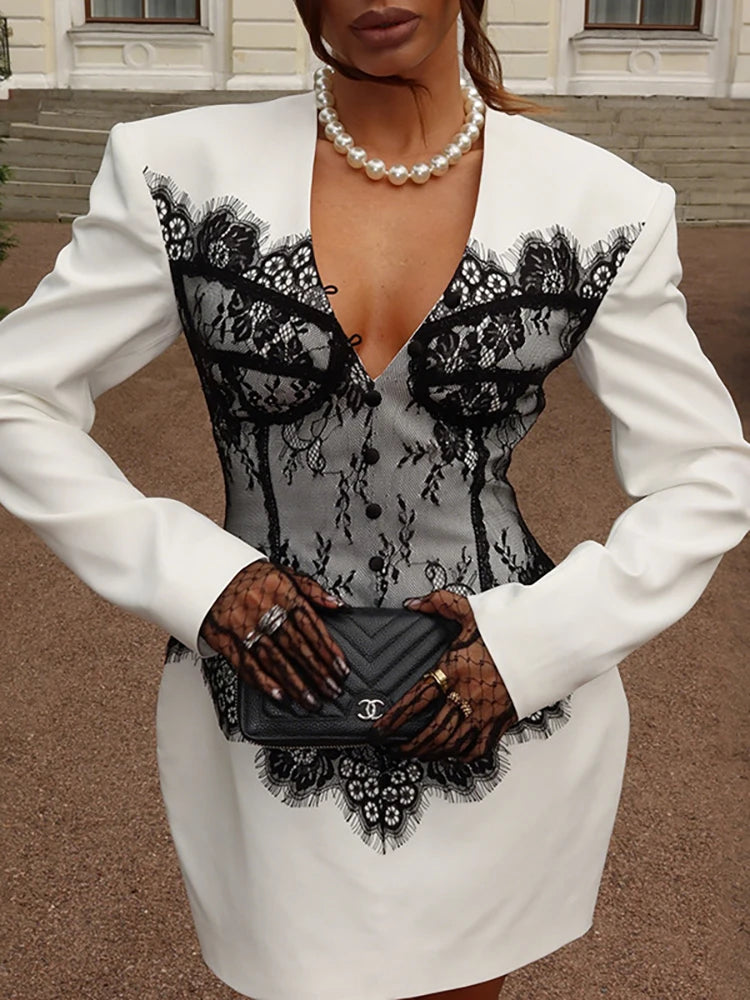 Long sleeve white dress with A-line silhouette and lace detailing