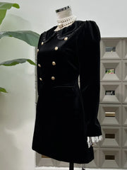 Long-sleeve black dress with contrast trim and button detailing front view