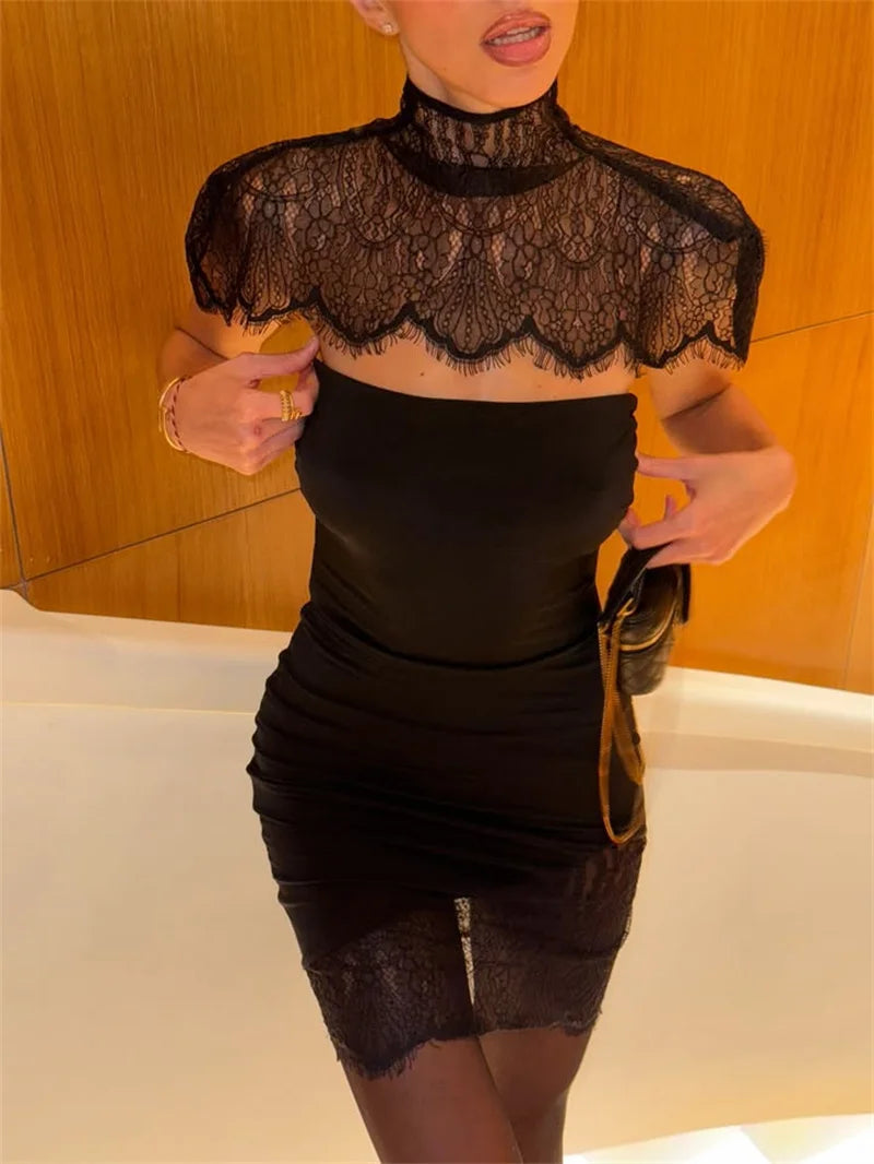 Hem detail showing a lace panel finish on the mini skirt, adding texture contrast while keeping the overall look sleek and refined.