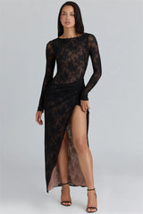 Full-length view highlights the round neckline, sheer lace sleeves, and slim floor-length skirt with a slit opening for movement.