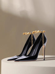 Black patent chain stiletto pumps with gold anklet styled for events