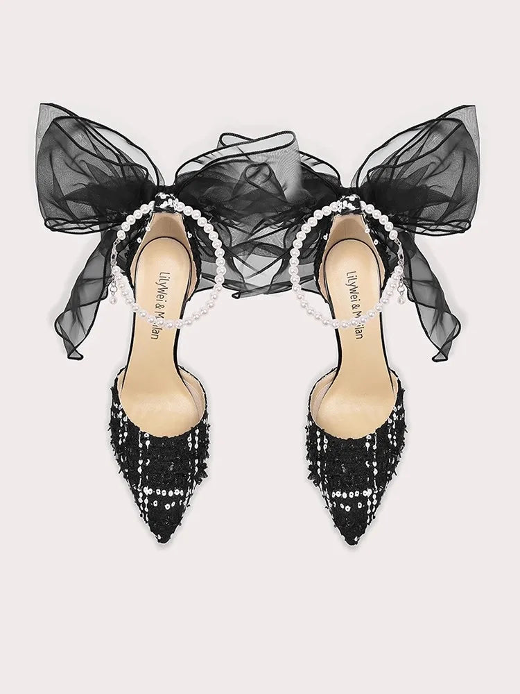 Black pearl sheer bow party sandals styled for formal celebrations