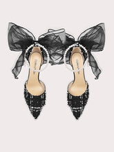 Black pearl sheer bow party sandals styled for formal celebrations