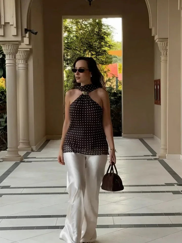 Polka dot halter top with a cropped silhouette and lace detailing