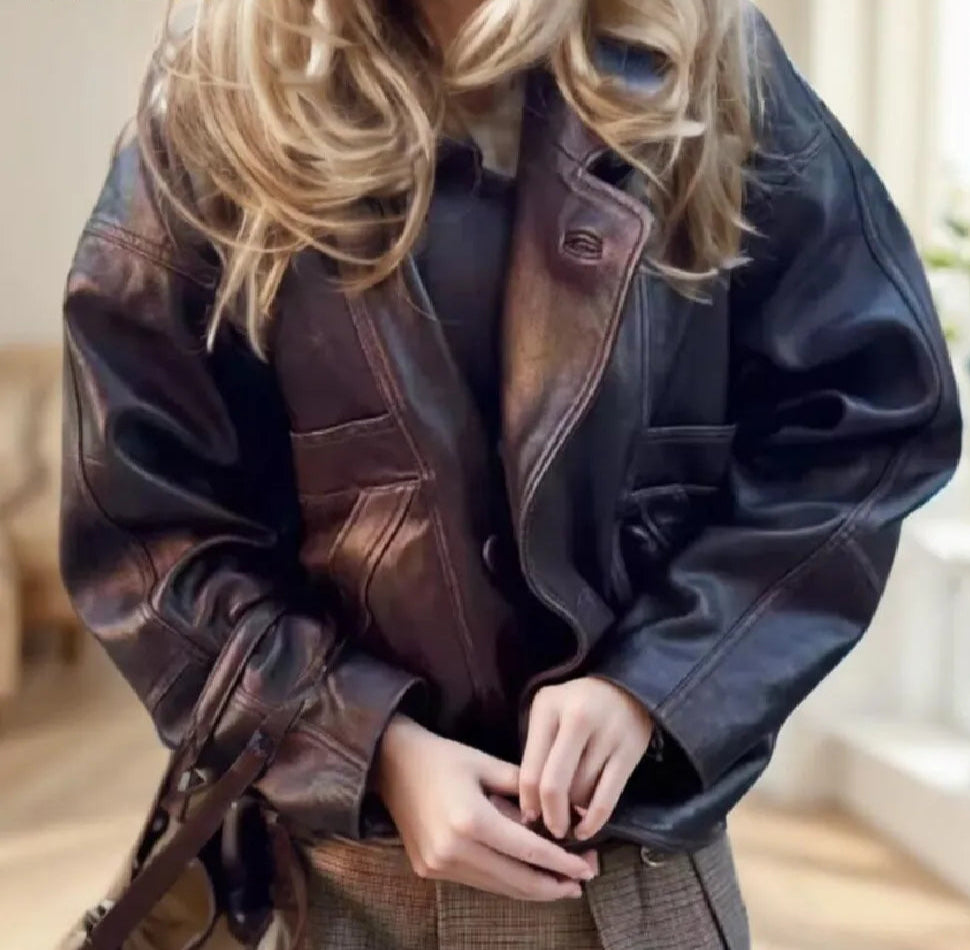 Black pu leather drop shoulder jacket styled for modern high street looks