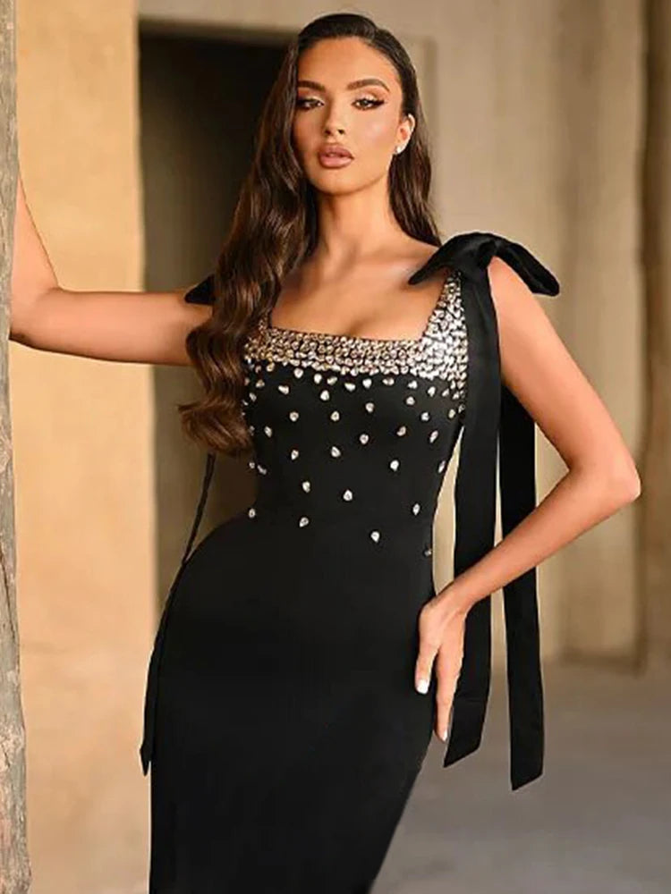 Black rhinestone bow mini dress styled for evening parties