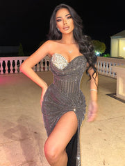 Black rhinestone mermaid dress with side slit styled for evening glamour