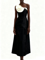 Black satin strapless midi dress with a sculpted 3D flower detail