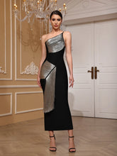 A woman wearing a Black and silver tassel one-shoulder midi dress styled for evening events in an elegant indoor setting.