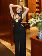 Black sleeveless mesh bandage dress styled for evening parties