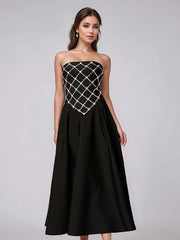 Black strapless rhinestone bandage dress styled for evening parties