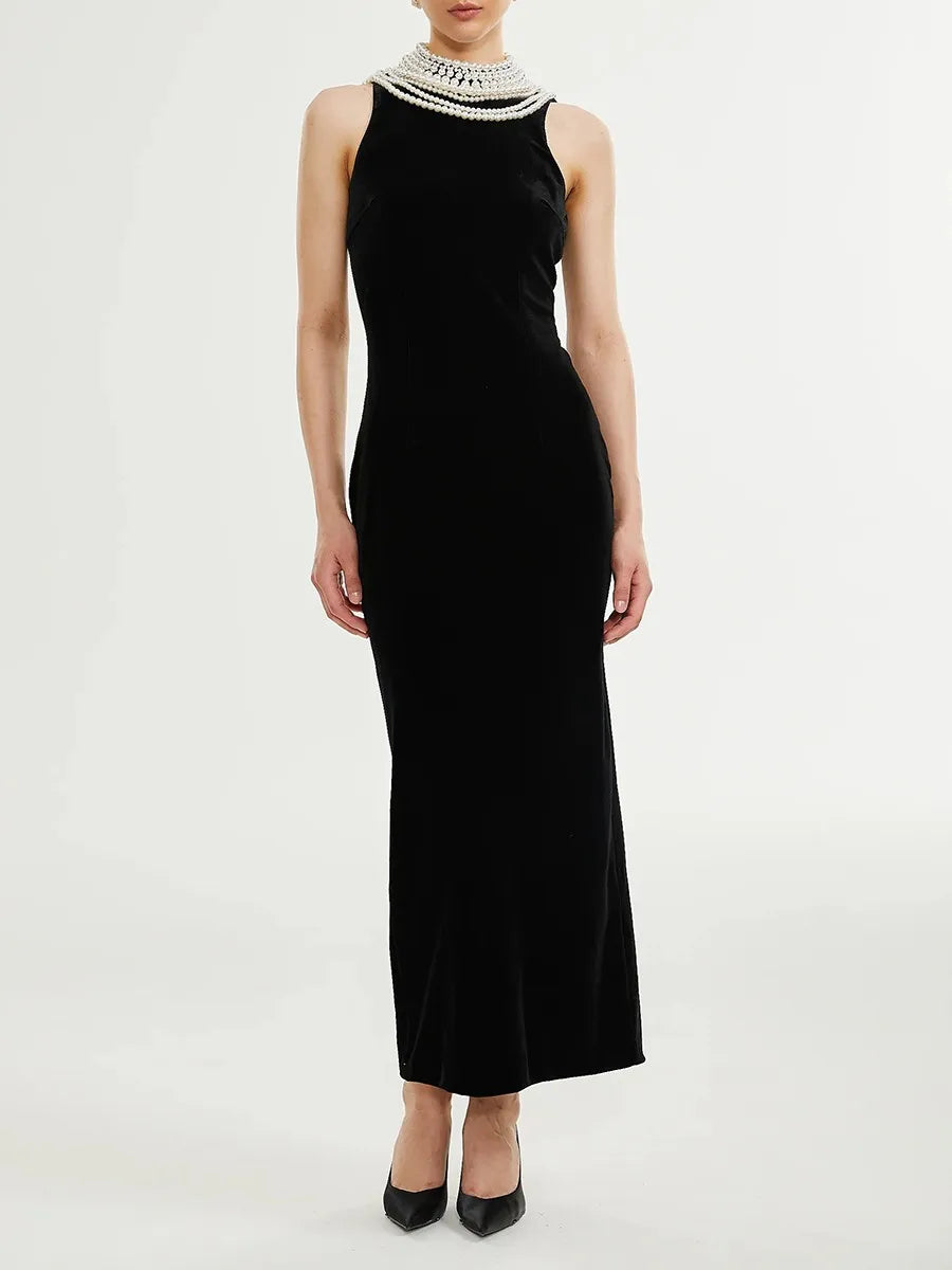 Black velvet maxi dress with draped pearl chain back detail