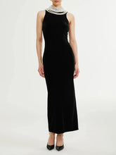 Black velvet maxi dress with draped pearl chain back detail