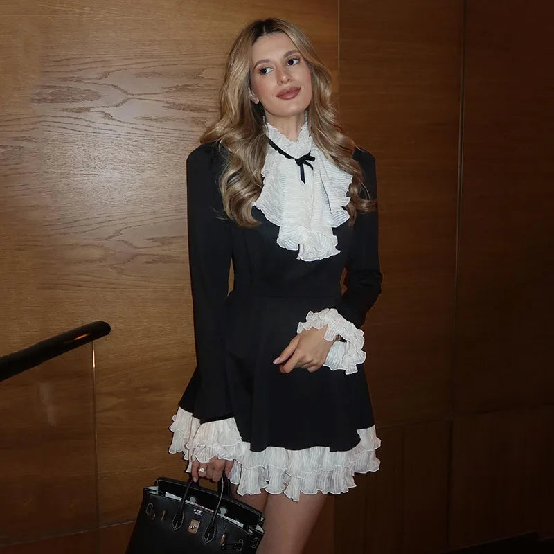 Black mini dress with white ruffles styled for retro party looks