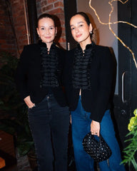 Structured jacket showing the neckline and smooth outerwear texture