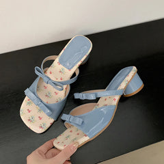 Blue butterfly-knot block heel slides with floral insole