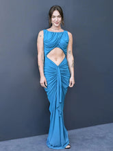 Blue cut-out sheath gown styled for evening events and formal occasions