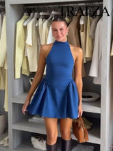 Blue folded mini dress styled in a summer wardrobe