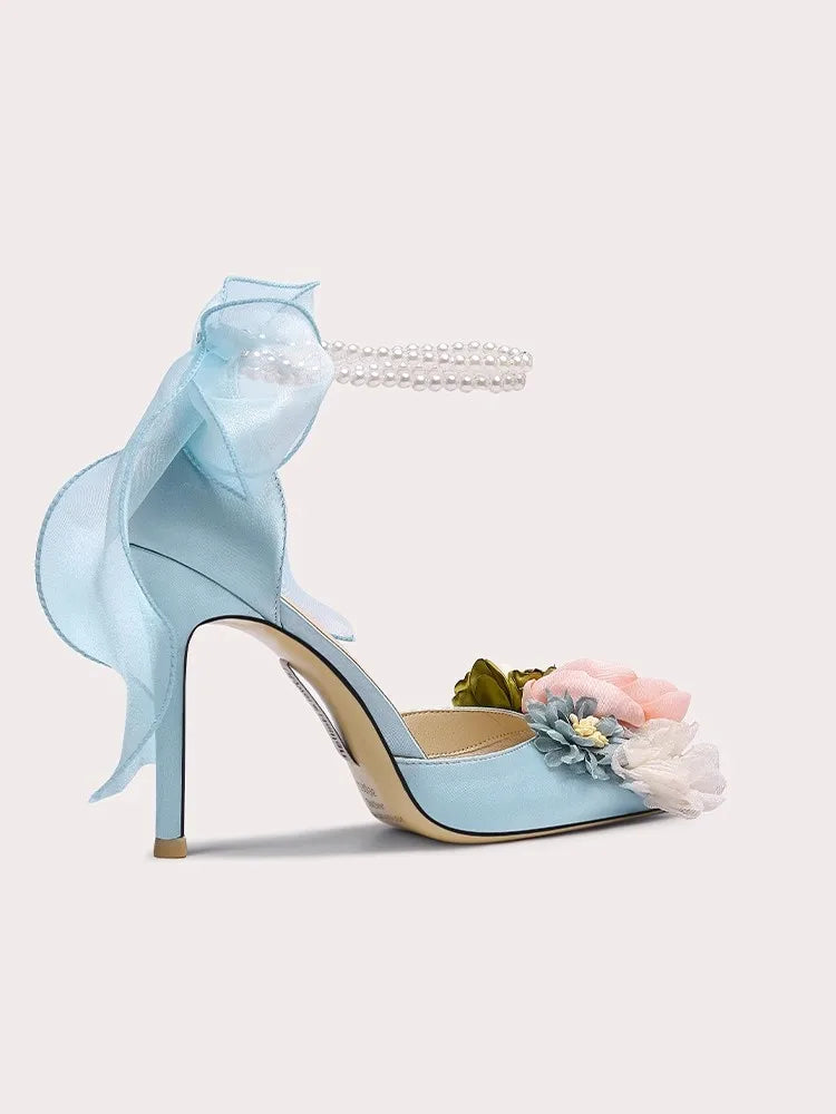 Blue silk floral bow sandals styled with sheer ribbon for formal occasions