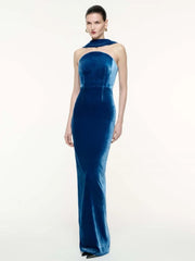Blue velvet strapless pleated dress styled for evening wear