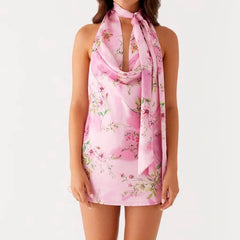 Above knee halter dress in pink floral print for summer events