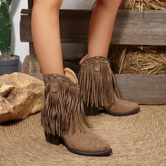 Close-up of suede tassel fringe and square heel detail