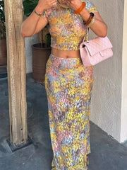 Person wearing a Pinterest-inspired summer mesh outfit with a figure-hugging silhouette handbag outdoors.
