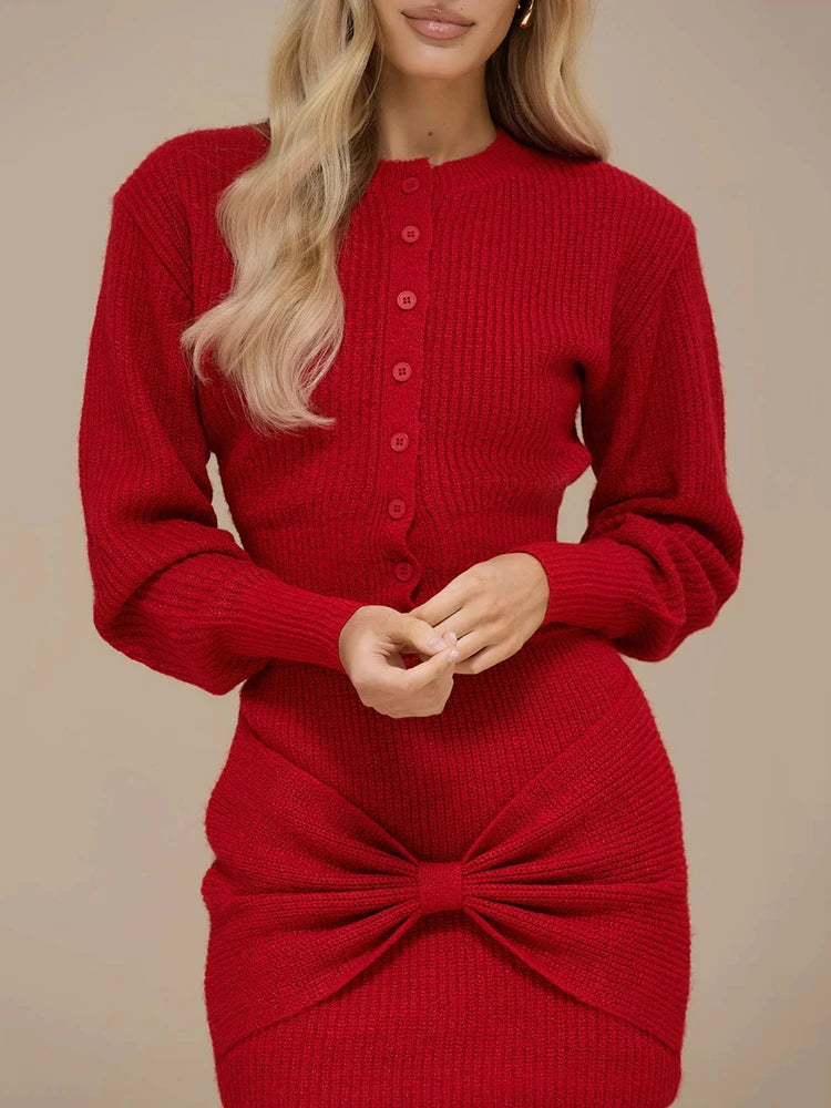 Detail view of the red mini skirt highlighting the gathered bow-twist feature at the front for a sculpted, flattering look.