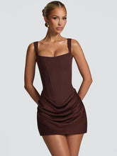 Brown backless mini dress styled for trending party looks