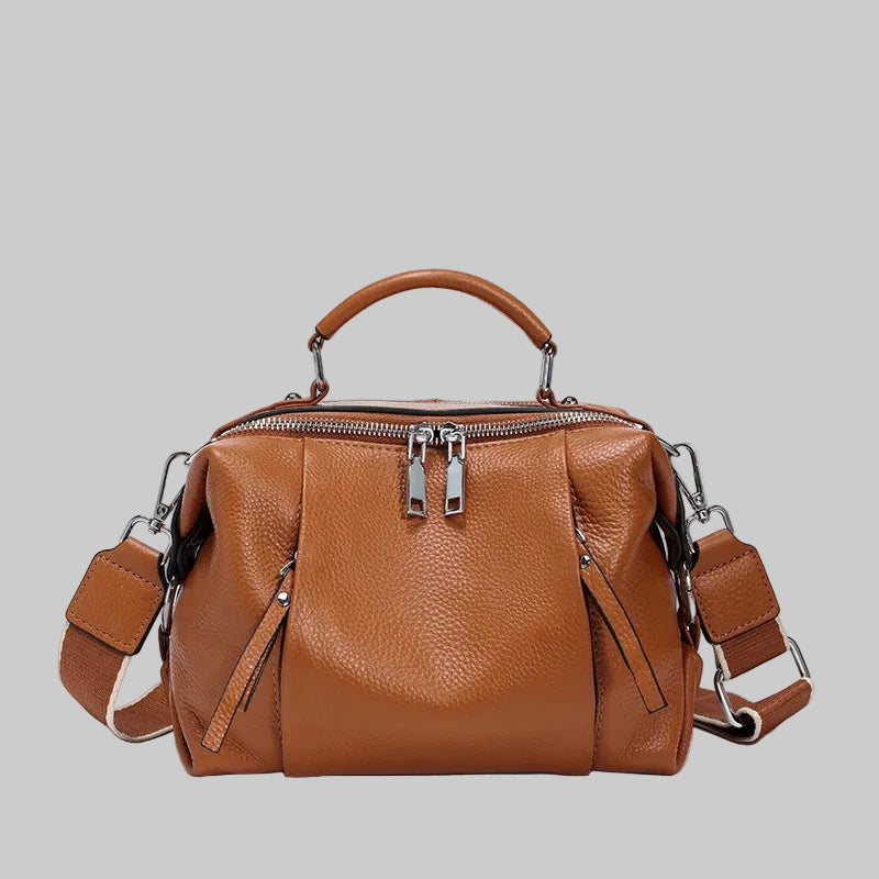Cowhide leather satchel bag with top handle and zip closure