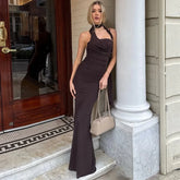 Brown halter maxi dress styled for summer night-out events