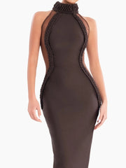 Close-up of braided mesh patchwork halter neckline on brown sheath maxi evening gown on a white background
