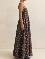 Model pose with hands in side pockets, highlighting the relaxed A-line skirt and easy drape through the hips.