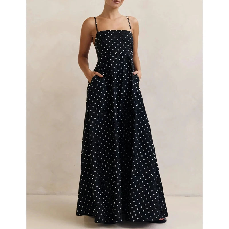 Full-length view showing the flowing hem and soft movement of the maxi skirt, with polka dot print visible throughout.