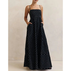 Full-length view showing the flowing hem and soft movement of the maxi skirt, with polka dot print visible throughout.
