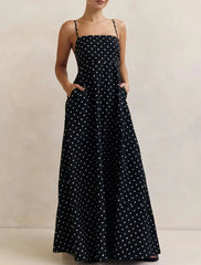Full-length view showing the flowing hem and soft movement of the maxi skirt, with polka dot print visible throughout.