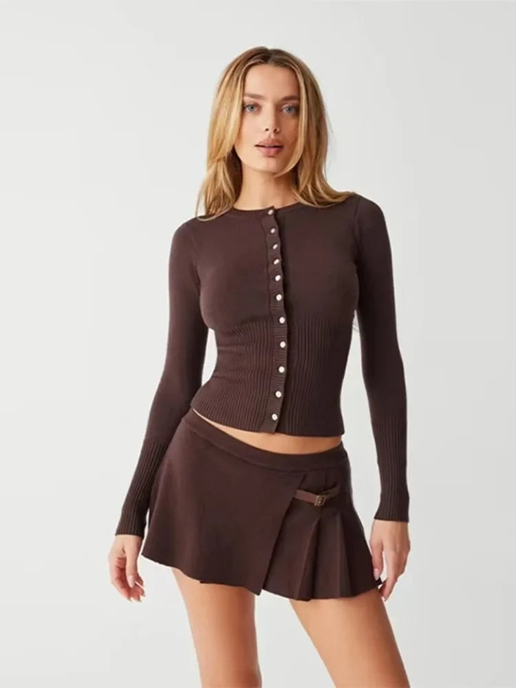 Woman in brown ribbed long sleeve knit top and mini skirt set