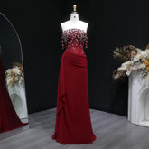 Full-length view of a floor-length mermaid gown with slim straps