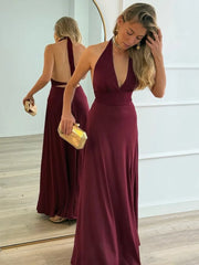 Burgundy halter backless gown styled for party elegance