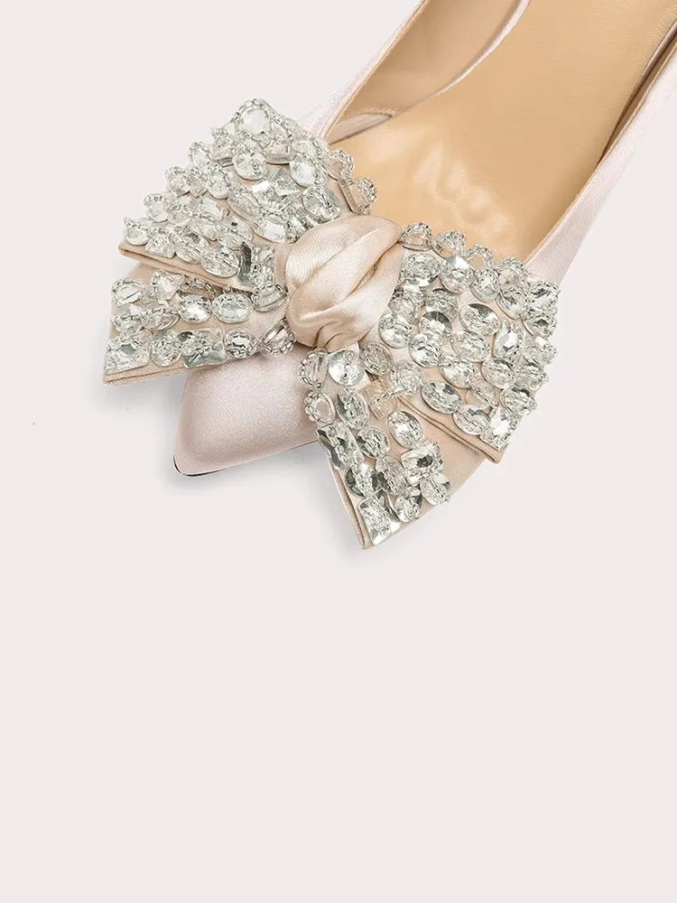 Butterfly knot pink stiletto heel displayed for formal and wedding occasions on a white background