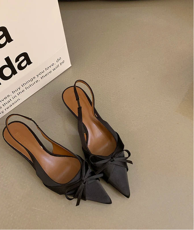 Women’s pointed-toe heels with bow detail and square heel