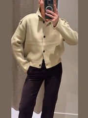 Front view highlighting the buttoned closure and soft drape of the knit cardigan