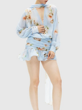 Floral patterned mini dress styled for garden parties and brunch