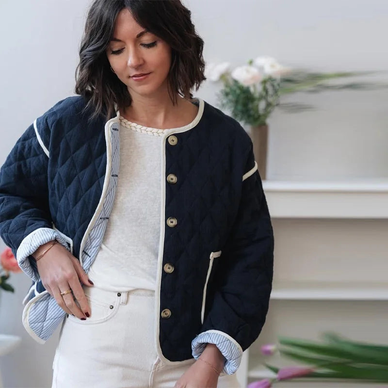 The jacket styled with jeans for a comfortable and chic winter streetwear look.