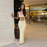 Champagne cut-out maxi dress styled for rooftop resort evenings