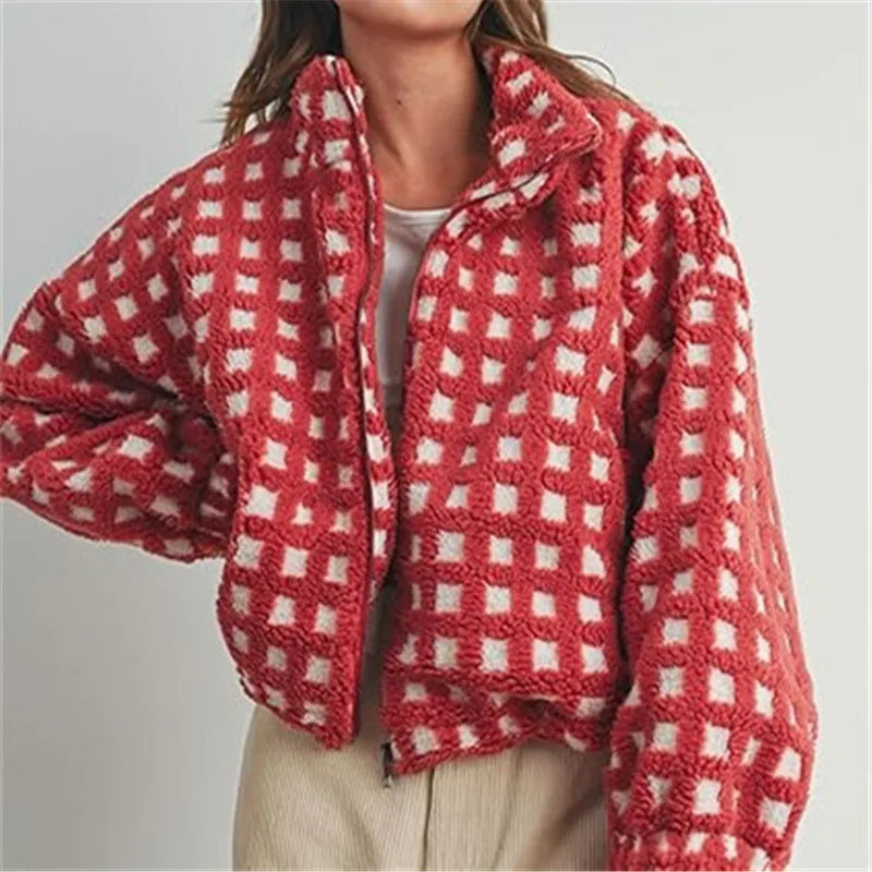Red and white checkered jacket worn by a person on a plain background