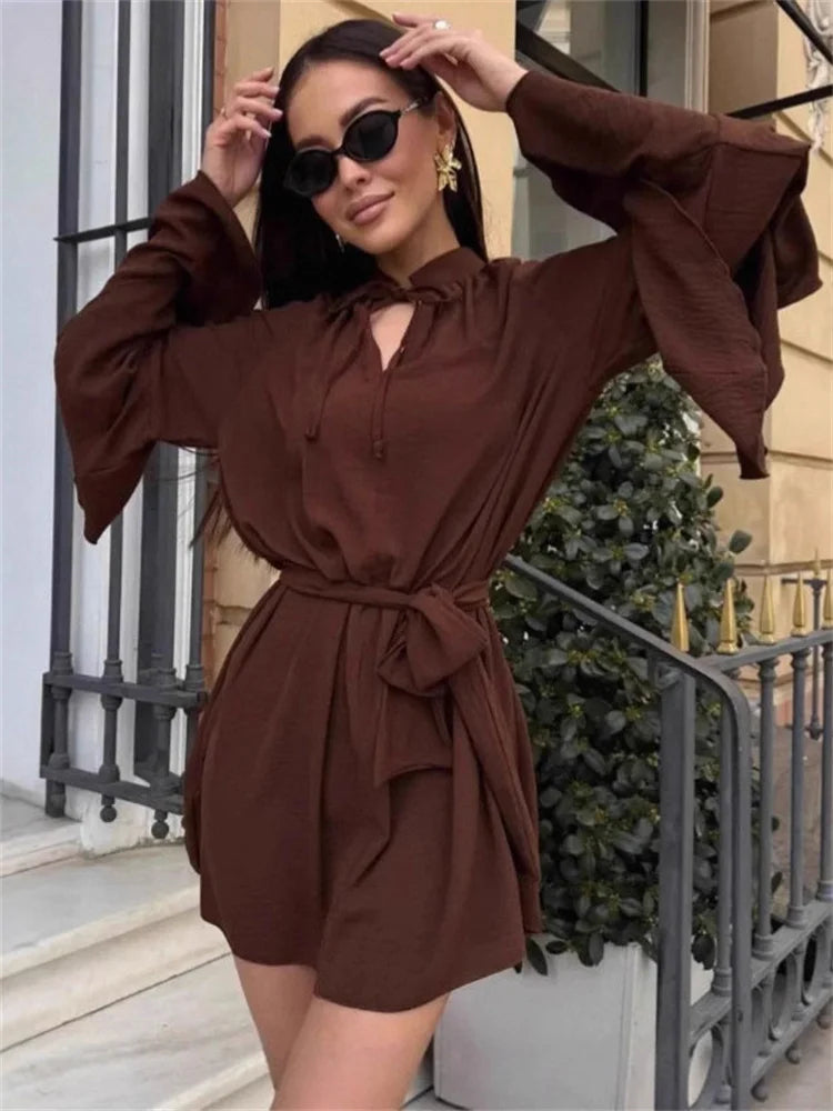 Above-knee neutral mini dress with ruffle sleeves and tie waist