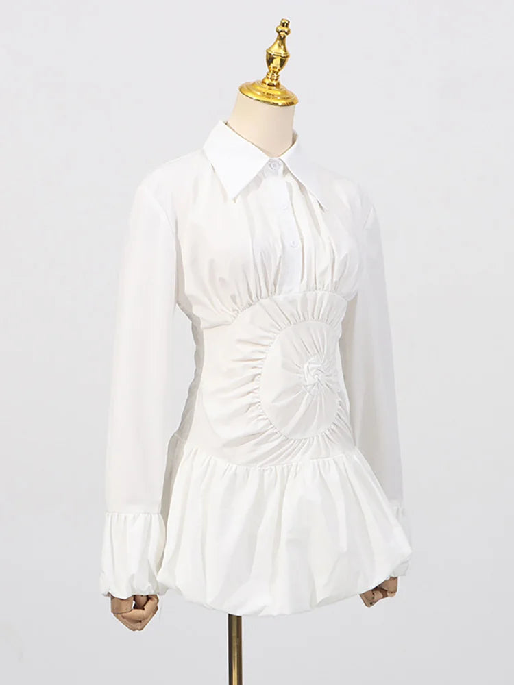 Cinched-waist white mini dress paired with minimal accessories on a mannequin against a white background
