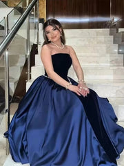 Elegant lifestyle shot of a velvet strapless gown styled for outdoor luxury event photography.