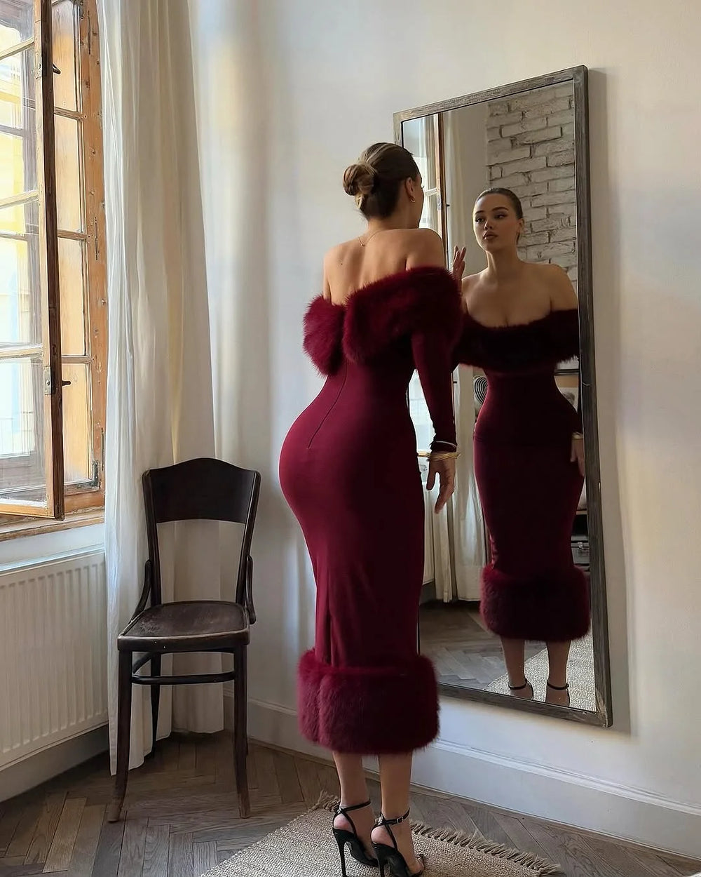 Natural lifestyle image of an off-shoulder midi dress styled indoors with soft posture, minimal lighting, and textured faux fur accents.